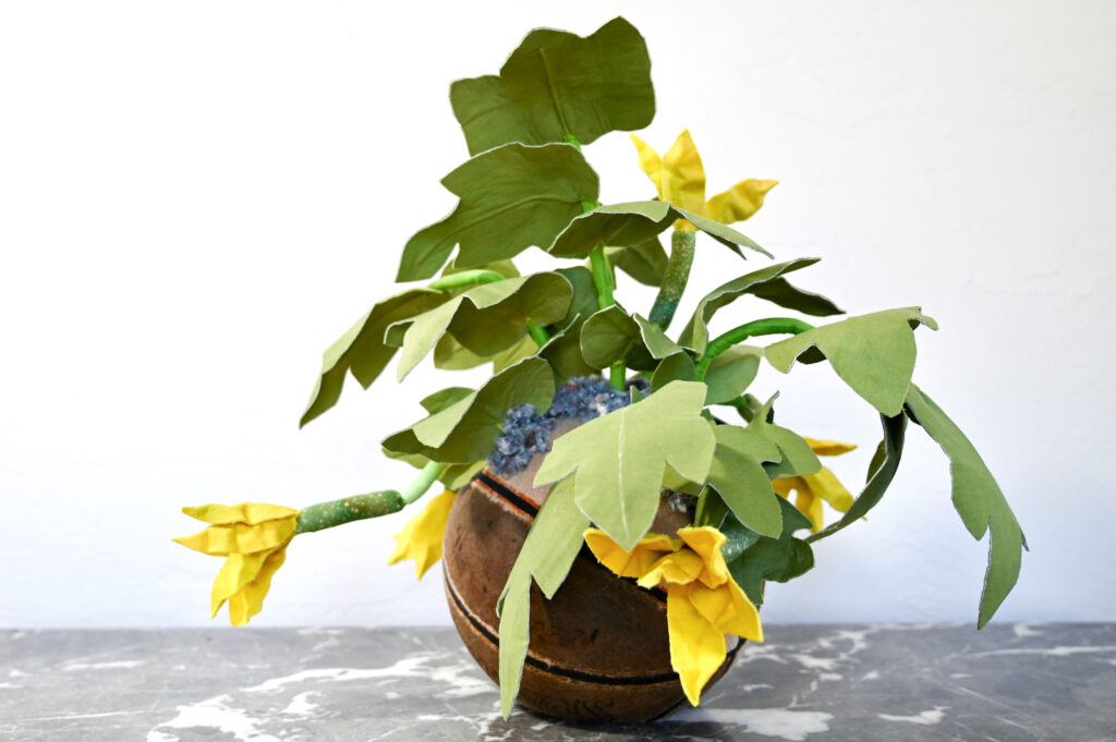 Alissa Alfonso, Squash Blossoms, 2026, hand—dyed textile waste, reused fiber—fill, wire, thread, textile stabilizer; base: reclaimed playground ball, shredded textile shoddy, 19 x 19 x 22 in.